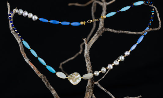 #18-27-59 Necklace-Elliptical Blue & Lavender Beads, Small Round Imitation Gold Beads, Dark Blue Glass Faceted Beads, 2-Long Pieces Mother-of-Pearl, Square Piece-Mother-of-Pearl, Freshwater Pearls, Imitation Gold Crowns & Sparkling Gold Balls at Clasps